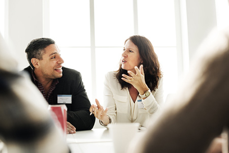 people talking at an electrical industry conference