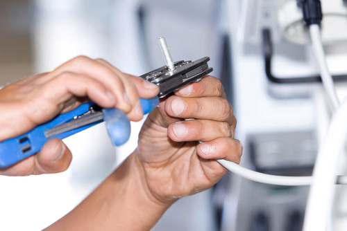 Electrician practicing electrical safety guidelines