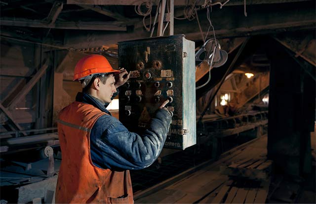 Mine worker using the electrical system.