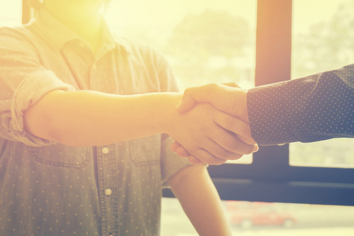 Men shaking hands, strong reputation management